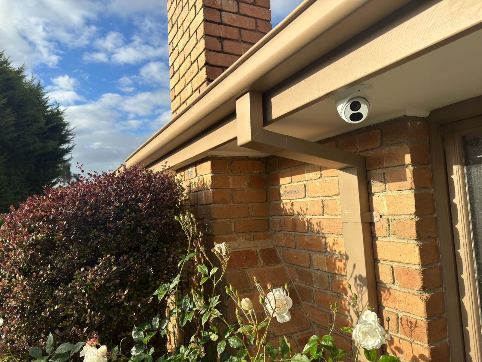 CCTV camera mounted under an eave by Neocore’s security division